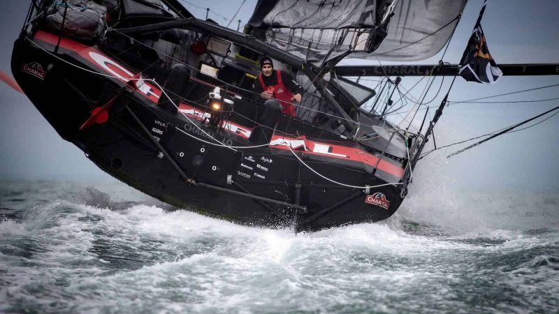 French skipper Jeremie Beyou sails his Imoca 60 monohull "Charal" few nautical miles before crossing the finish line placed 13th, of the Vendee Globe round-the-world solo sailing race off the coast of Les Sables-d'Olonne, western France, on February 6, 2021. (Photo by LOIC VENANCE / AFP)
